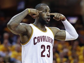 Cleveland Cavaliers forward LeBron James (23) reacts against the Atlanta Hawks during Game 1 of a second-round NBA playoff series Monday, May 2, 2016, in Cleveland. (AP Photo/Tony Dejak)