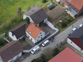 An aerial photo of a couple’s house in Hoexter-Bosseborn, Germany, on May 4, 2016. A woman has told German investigators that she was held captive for around three months and was physically abused by a couple who are in custody for the deaths of two other women, police said Wednesday. (Friso Gentsch/dpa via AP)