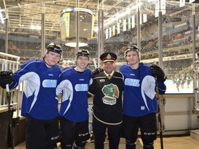 London Police Chief John Pare with London Knight L to R Christian Dvorak, Mitch Marner and Matthew Tkachuk.