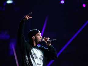Drake performs during the iHeartRadio Music Festival in Las Vegas, Nevada in this September 21, 2013, file photo. Grammy-winning rapper Drake surprised fans by releasing an album on iTunes early on February 13, 2015, following in the footsteps of pop singer Beyonce, who put out her fifth studio album with no advance notice just over a year ago. REUTERS/Steve Marcus/Files
