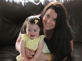 Laura McAleer and her daughter Keira, 16 months at their Kingston home on Wednesday May 4 2016. McAleer is organizing a charity fashion show, Keira's Unbreakable Spirit Fashion Show