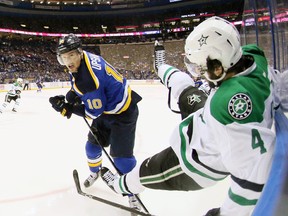 St. Louis Blues right winger Scottie Upshall checks Dallas Stars defenceman Jason Demers into the boards in the first period of Game 3 of the Western Conference semifinals against the Dallas Stars in St. Louis on May 3, 2016. (Chris Lee/St. Louis Post-Dispatch via AP)