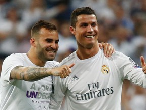 Real Madrid’s Cristiano Ronaldo and Jese celebrate after beating Manchester City in the Champions League semifinal Wednesday at Estadio Santiago Bernabeu in Madrid. (Reuters/Paul Hanna)