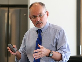 Luke Hendry/The Intelligencer
Dr. Kieran Moore speaks about the problem of over-prescribing painkillers while presenting statistics to the Hastings and Prince Edward Counties Board of Health in Belleville Wednesday. He said the federal and provincial governments must act to address the problem and prevent deaths.