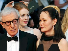Director Woody Allen (L) and his wife Soon-Yi Previn arrive on the red carpet for the screening of the film "Irrational Man" out of competition at the 68th Cannes Film Festival in Cannes, southern France, May 15, 2015. (REUTERS/Regis Duvignau)