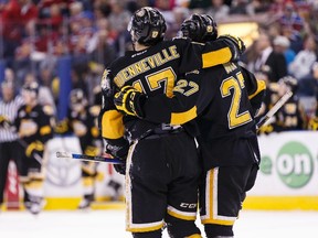 Brandon's John Quenneville (17) and Reid Duke (27) celebrate Duke's goal during the third period of a WHL playoff game between the Edmonton Oil Kings and the Brandon Wheat Kings last month. (Ian Kucerak file photo)