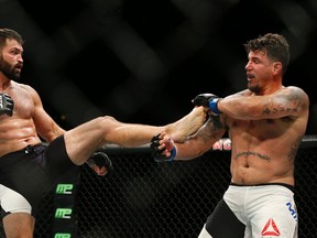 Andrei Arlovski kicks at Frank Mir during their heavyweight bout at UFC 191 Saturday, Sept. 5, 2015, in Las Vegas. (AP Photo/John Locher)