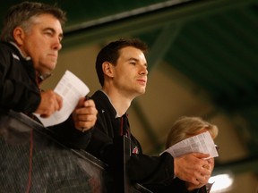 John Chayka (right) and coach Dave Tippett of the Arizona Coyotes watches the team’s prospect development camp at the Ice Den on July 8, 2015 in Scottsdale, Arizona. (Christian Petersen/Getty Images/AFP)