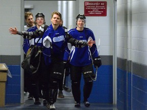 London Knight forwards CJ Yakimowicz, Christian Dvorak, Matthew Tkachuk, and Mitch Marner, l-r, arrive at the Western Fair District Sports Centre for practice on Wednesday. (MORRIS LAMONT, The London Free Press)