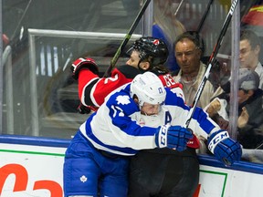 Marlies'  Richard Clune slams into Albany Devils' Seth Helgeson in Game 1 of their AHL playoff series at Ricoh Coliseum on Wednesday. (Ernest Doroszuk/Toronto Sun)
