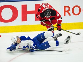 Albany Devils’ Joseph Blandisi knocks down Rinat Valiev of the Toronto Marlies during AHL playoff action. (Ernest Doroszuk, Toronto Sun)