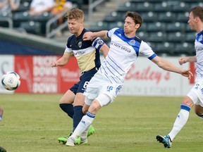 FC Edmonton forward Daryl Fordyce, shown here battling an Armada opponent for the ball, was involved in the play that resulted in the Eddies goal in their 1-0 victory Wednesday in Jacksonville, Fla. (Supplied)