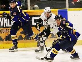 Trenton's Danny Hanlon battles a pair of Kirkland Lake Gold Miners during Wednesday night action at the Dudley Hewitt Cup in Kirkland Lake. Hanlon scored once plus added two assists in a 5-1 TGH triumph. (Bruce Bell/The Intelligencer)