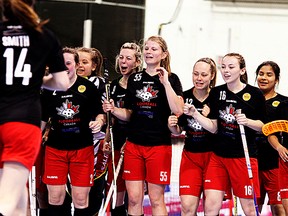 Team Canada players celebrate their 5-3 win over Japan in Game 1 of the IFF U19 women's floorball world championships, Wednesday, at Yardmen Arena before a record crowd of 3,151. (Emily Mountney-Lessard/The Intelligencer)