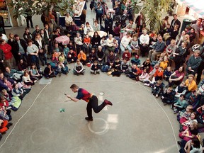 A busker entertains children, and parents, as part of the Festival of Fools at The Forks. A local musician is encouraging the city to draft clear rules on busking. (FILE PHOTO)