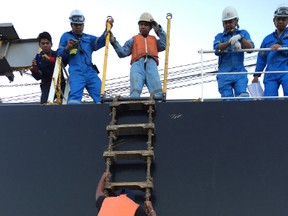 In this May 4, 2016 image released by the U.S. Coast Guard, a man arrives to Honolulu after being rescued by merchant mariners in the southeastern Pacific and surviving months at sea. The merchant ship that rescued the man southeast of Hawaii notified the Coast Guard and he was brought to Honolulu in good condition Wednesday. (Petty Officer 2nd Class Tara Molle/U.S. Coast Guard via AP)