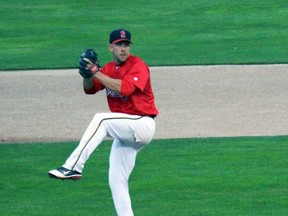 Pitcher Mike Damchuk of the Sarnia Braves winds up during Game 2 of the league championship series against Strathroy on Wednesday August 26, 2015 in Sarnia, Ont. Damchuk and the Braves begin the 2016 season Friday night on the road against the Oakridge Reds. (Terry Bridge, The Observer)
