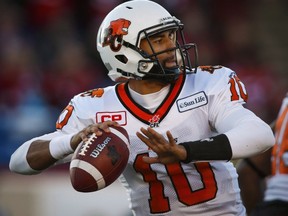 Lions quarterback Jonathon Jennings looks for a receiver during first half CFL Western Semifinal action against the Stampeders in Calgary on Nov. 15, 2015. The Lions have locked up Jennings through the 2018 season. (Jeff McIntosh/THE CANADIAN PRESS)