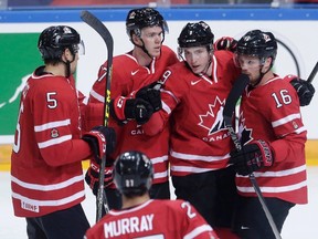 Canada’s Matt Duchene, second right, celebrates with teammates after scoring against the Czech Republic in Prague Tuesday, May 3, 2016. (THE CANADIAN PRESS/AP/Petr David Josek)