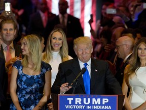 Republican presidential candidate Donald Trump is joined by his wife Melania, right,and daughter Ivanka, left, as he arrives for a primary night news conference, Tuesday, May 3, 2016, in New York. (AP Photo/Mary Altaffer)