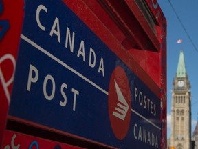 A Canada Post mailbox is seen near Parliament Hill in Ottawa, Thursday May 5, 2016. The government announced it will review Canada Posts operations. (THE CANADIAN PRESS/Adrian Wyld)