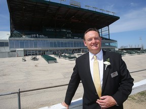 Assiniboia Downs CEO Darren Dunn stands outside the track's grandstand in Winnipeg, Man. Thursday May 5, 2016.