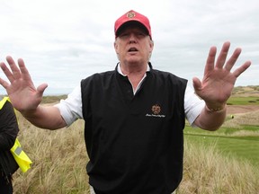 Donald Trump gestures during a tour of his new Trump International Golf Links course on the Menie Estate near Aberdeen, north east Scotland, in this file photograph dated June 20, 2011. (REUTERS/David Moir/files)