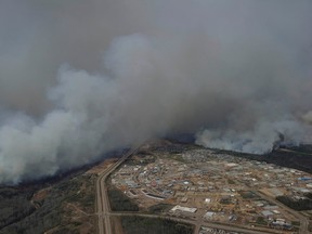A Canadian Joint Operations Command aerial photo shows wildfires near neighborhoods in Fort McMurray, Alberta, Canada in this May 4, 2016 image posted on social media.  (Courtesy MCpl VanPutten/CF Operations/Handout via REUTERS)
