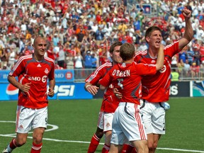 TFC’s Andrew Boyens (right) celebrates a goal during the team’s inaugural season in 2007. (SUN FILES)