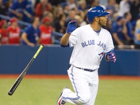 Toronto Blue Jays Edwin Encarnacion tosses his bat after hitting a home run against the Texas Rangers in the third inning of their game at the Rogers Centre in Toronto on May 5, 2016. (THE CANADIAN PRESS/Fred Thornhill)