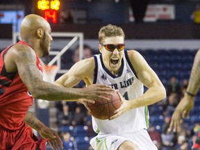 Logan Stutz of the Niagara River Lions races past Tyrone Watson of the Orangeville A?s in St. Catharines on April 7. Stutz, let go by the London Lightning, found a home with the River Lions and produced an MVP season. (JULIE JOCSAK/St. Catharines Standard)