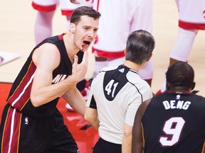 Miami Heat guard Goran Dragic shows off his bloody lip after being charged with a foul during Thursday night's game. (USA TODAY SPORTS)