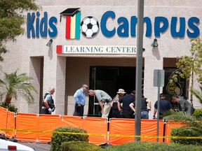 North Las Vegas authorities investigate the scene of a fatal shooting at a daycare Thursday, May 5, 2016, in North Las Vegas, Nev. (AP Photo/John Locher)