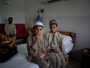Pakistani children Abdul Rasheed, 9, left, and Shoaib Ahmed, 13, sit in a room during the day at a hospital in Islamabad, Pakistan, on May 6, 2016. The boys are normal active children during the day. But once the sun goes down, they both lapse into a vegetative state — unable to move or talk. Dr. Javed Akram, told The Associated Press on Thursday that he had no idea what was causing the symptoms. (AP Photo/B.K. Bangash)