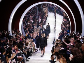 Models wear creations for Christian Dior's Fall-winter 2016-2017 ready to wear collection presented in Paris, France, Friday, March 4, 2016. (AP Photo/Francois Mori)