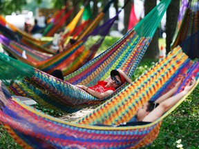 In this July 2, 2014 file photo, people rest in hammocks at the Spruce Street Harbor Park in Philadelphia. The City of Brotherly Love will get a lot of attention later this summer during the Democratic National Convention, with attractions ranging from American history classics to new parks and outdoor venues. (AP Photo/Matt Rourke, File)