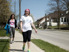 Jenn Miller walks down Canterbury Street in Ingersoll on the fourth day of her journey from London to Ottawa. She is walking to raise awareness and funds for diabetes and meet with the Canadian Minister of Health Jane Philpott. (BRUCE CHESSELL, Sentinel-Review)