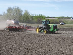 Jakob Kruse operates the air seeder at Johannes Heupel’s farm near Stony Plain as he plants hard red spring wheat on May 2. Farmers are hoping for rain to germinate crops. - photo by Marcia Love
