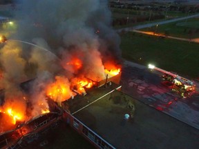 A former school engulfed in flames near the intersection of Britannia Rd. and Trafalgar Rd. in Milton. (Pascal Marchand/Special to the Toronto Sun)