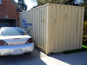 A temporary rental storage box at a home on Carriage Hill Drive in London on Friday May 6, 2016. (MORRIS LAMONT, The London Free Press)
