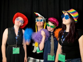 Emily Schram, left, Landon Peden, Aubrey Keehn, and Teagan Goerz dress up for the photo booth during the Mental Health Awareness Summit at the Family Connection Centre in Stony Plain on Monday, May 2, 2016. These four students were MCs for the summit, as well as planned and organized the three-day event. - Photo by Yasmin Mayne