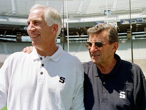 In this Aug. 6, 1999, file photo, Penn State head football coach Joe Paterno (right) poses with his defensive coordinator Jerry Sandusky during Penn State Media Day at State College, Pa. Paterno's son dismissed as "bunk" a new court document alleging his father knew that Sandusky engaged in child sexual abuse as far back as 1976. (Paul Vathis/AP Photo/Files)
