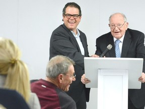 Tim Culliton and his dad Keith share a laugh during remarks at the launch this week of Always a Silver Lining/The Keith Culliton Story by author Diane Sewell. (SCOTT WISHART/The Beacon Herald)