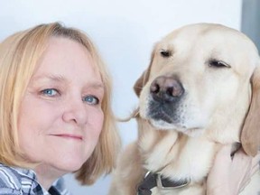 Joy Tomkinson with her assistance dog, Joel.