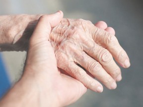 holding senior hands