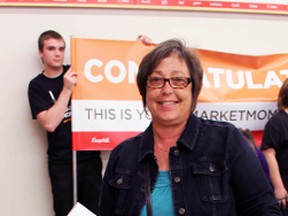 Sharon O'Donnell from Sarnia earned $123 worth of free groceries from Ken's Valu-Mart on Friday May 6, 2016 in Sarnia, Ont. The store gave away free groceries to everyone in line at 4:20 p.m. as part of Loblaw's Market Moments campaign. (Terry Bridge/Sarnia Observer/Postmedia Network)