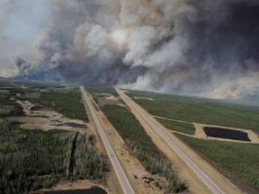 Aerial view of highway 63 south of Fort McMurray, Alta., taken from a CH-146 Griffon helicopter on May 5, 2016 in this handout photo. THE CANADIAN PRESS/HO - DND, MCPL VanPutten, 3 CSDB Imaging