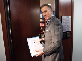 Conservative MP Maxime Bernier enters the offices of the Conservative Party of Canada as he officially launches his bid for the leadership of the party, on Thursday, April 7, 2016 in Ottawa. THE CANADIAN PRESS/Justin Tang