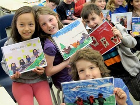 Jadis Cheechoo, left, Hailey Mahoney, Graeme David and Merrick Bigras, students in Catherine Byers grade 3/4 class at Centennial Public School show off their adaptations of fairy tales on Friday May 6 2016. Kelsey Curtis For the  Kingston Whig-Standard/Postmedia Network