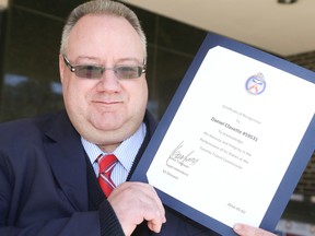 TTC Operator Daniel Clavette at 41 Division and receives a certificate of recognition on Friday May 6, 2016. (VERONICA HENRI, Toronto Sun)